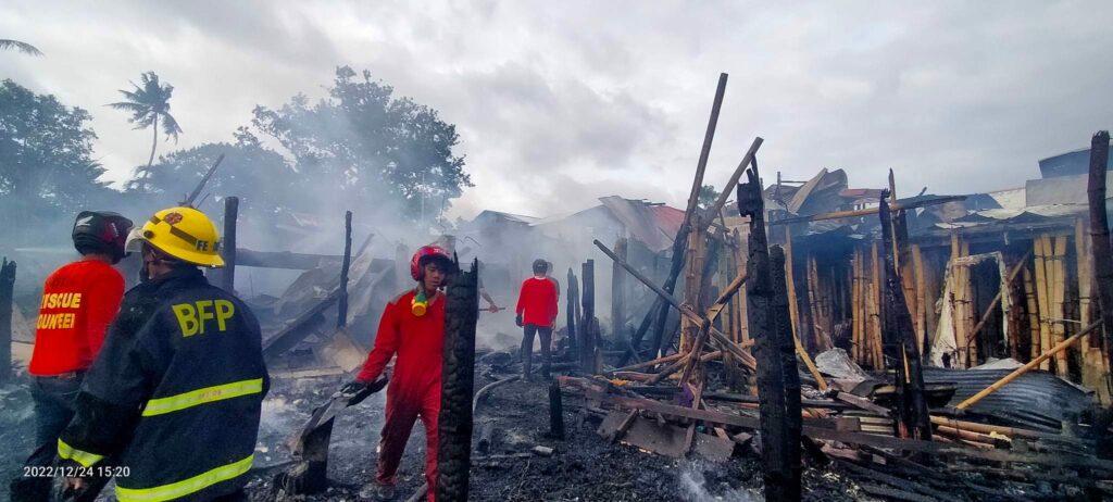 Bureau of Fire Protection officers and volunteer units scour the area for their clearing operation after the big blaze.  Photo by Aaron Lloyd Balala Refoyo