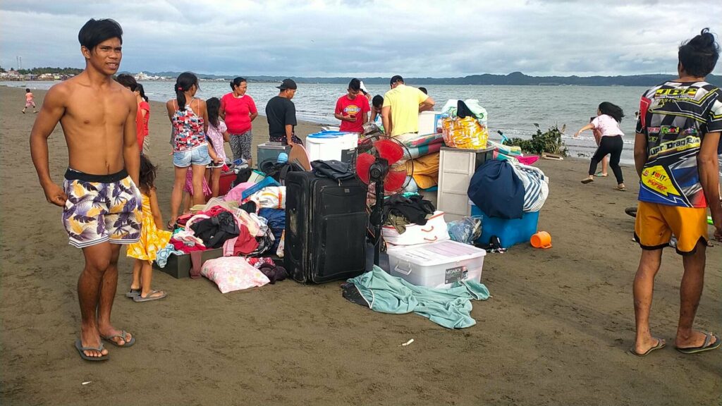 Residents unprepared during the fire incident dragged some of their household materials onto the shoreline as they watch their houses consumed by the blazing fire early this afternoon at Brgy. San Juan, Molo.  Photo by Aaron Lloyd Balala Refoyo