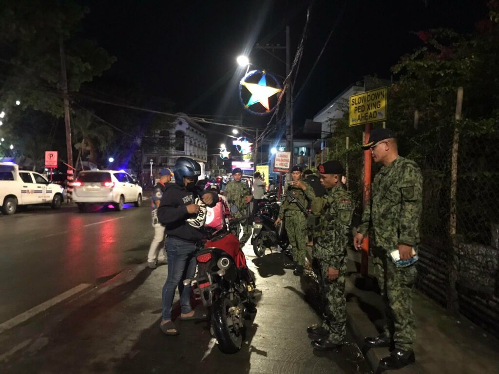 On scene, on the act. Iloilo PSTMO with PNP personnel on apprehending motorcycles with modified muffler which may cause public distraction. | Photo by Aaron Lloyd Refoyo.