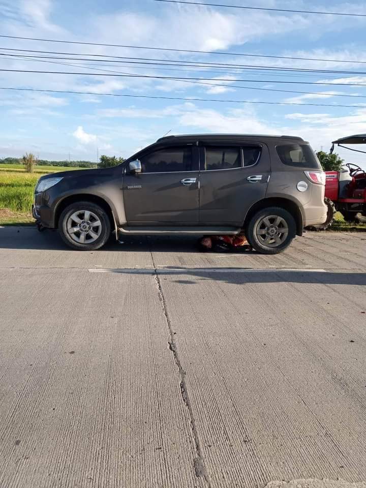 The photo shows a man under the SUV. | Photo from Rowen Ranque used with permission.